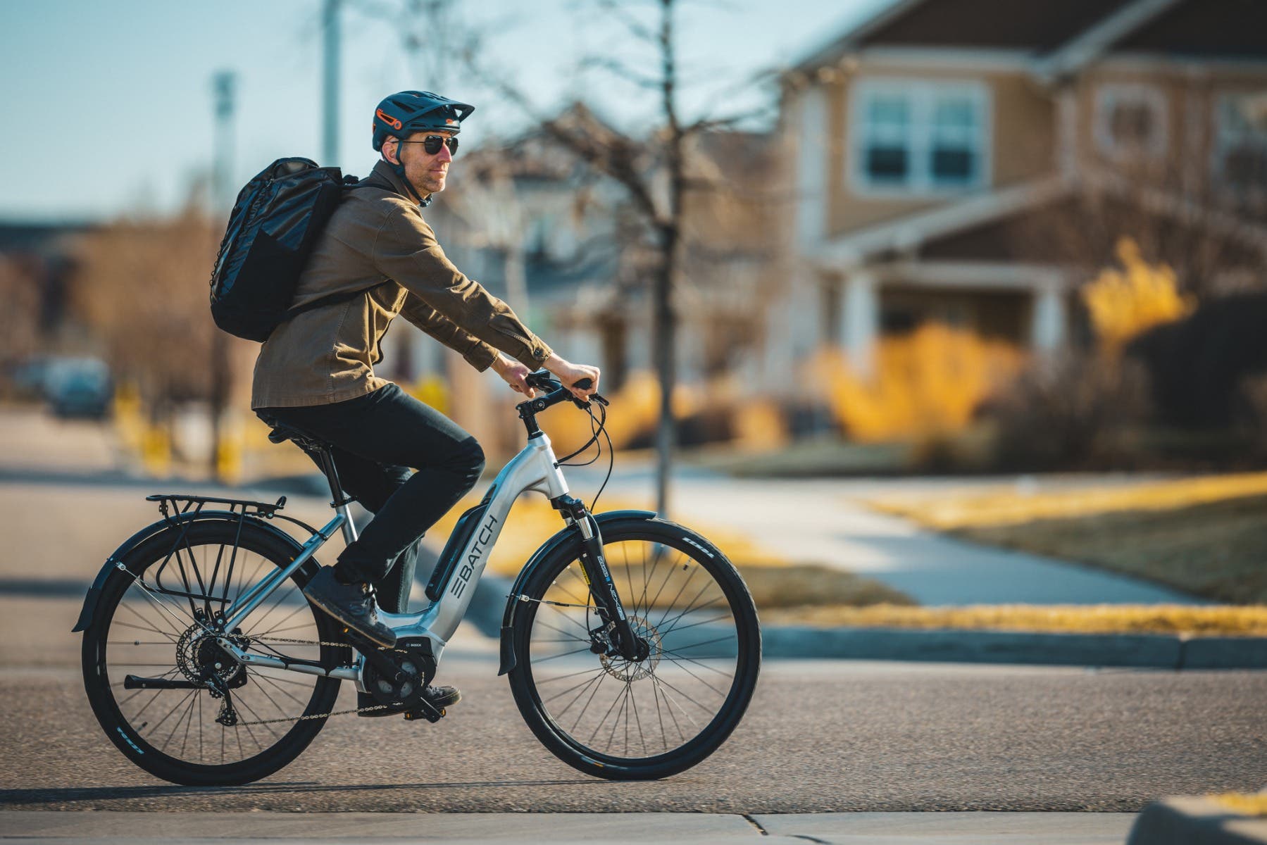 man riding a batch electric bicycle